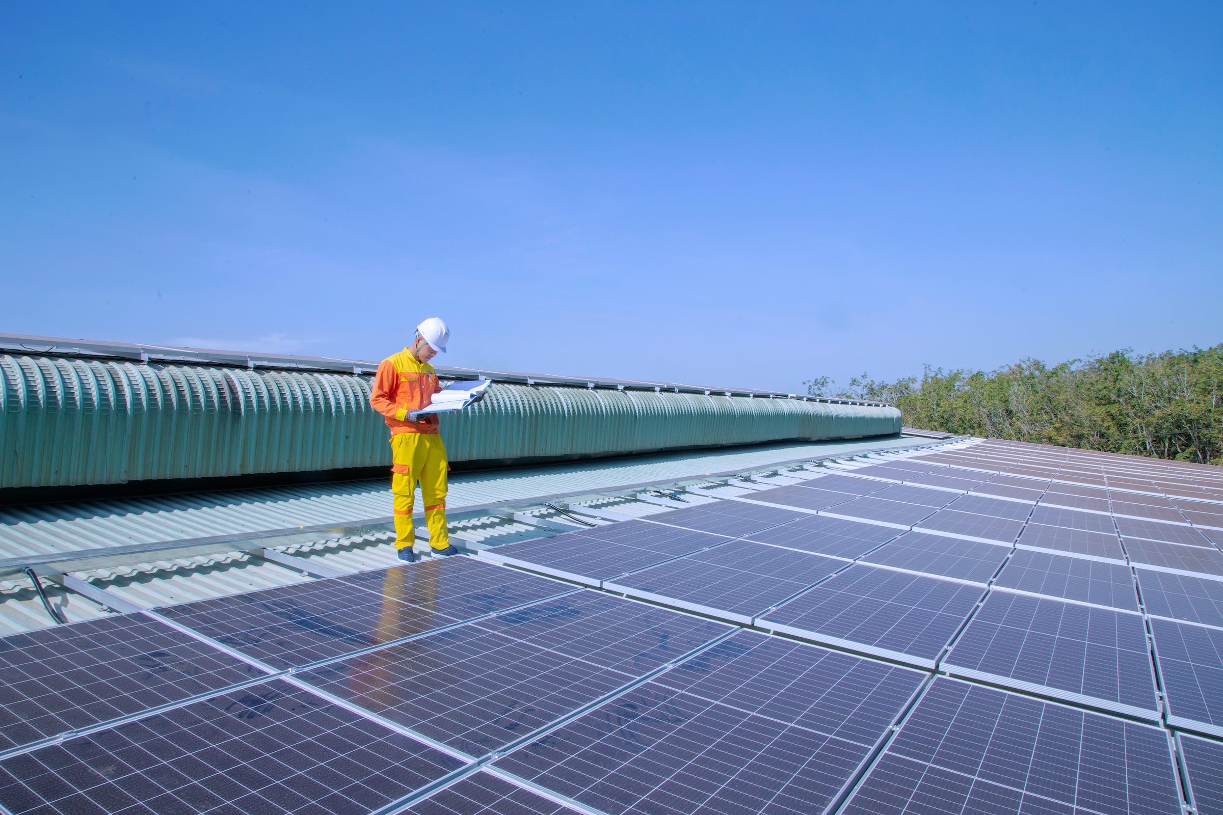 image of engineer on the solar panel